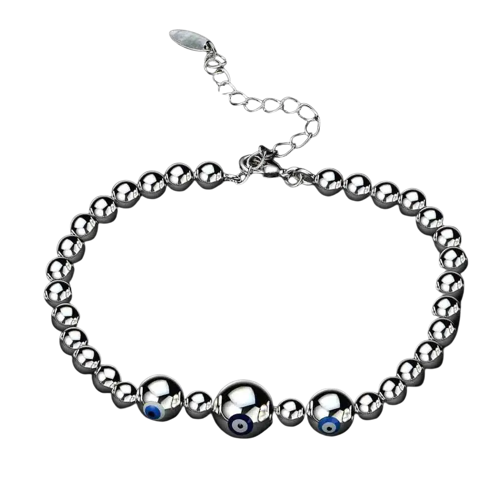 Sterling silver bracelet for women with three polished metal evil eye charms featuring blue centers