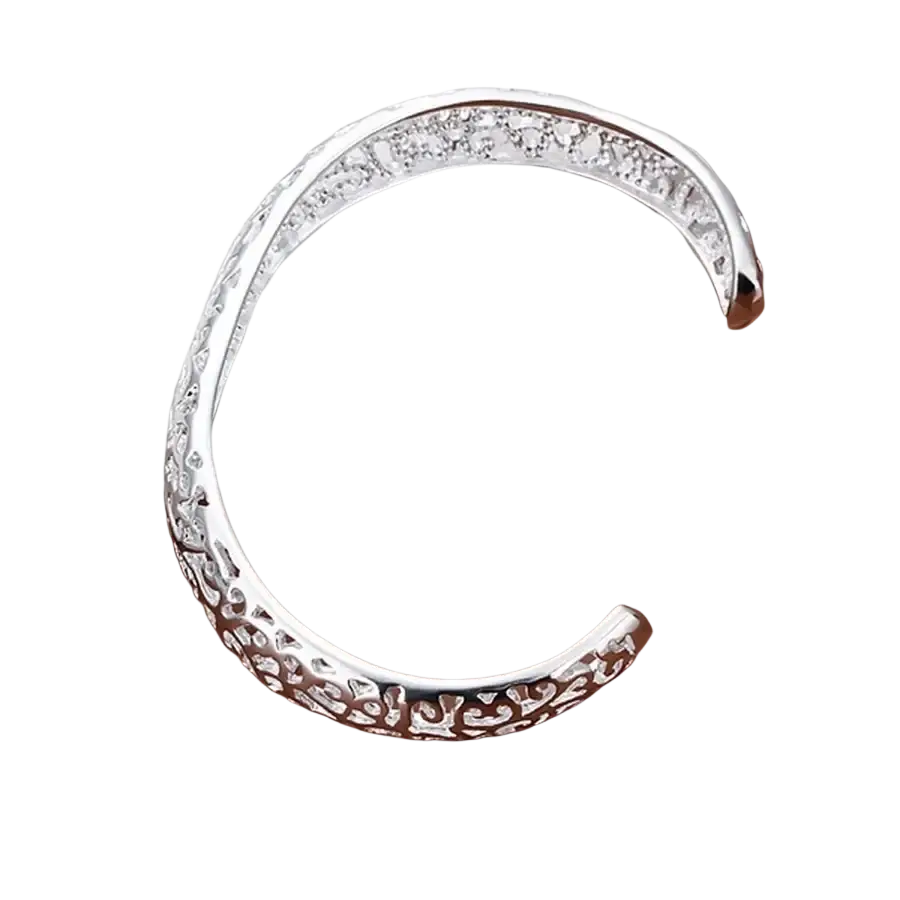 Sterling silver filigree cuff bracelet with intricate design and embedded clear crystals in a silver finish