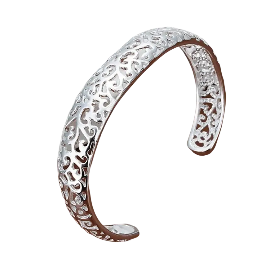 Sterling silver filigree cuff bracelet with intricate scrollwork patterns and open design in polished silver tone