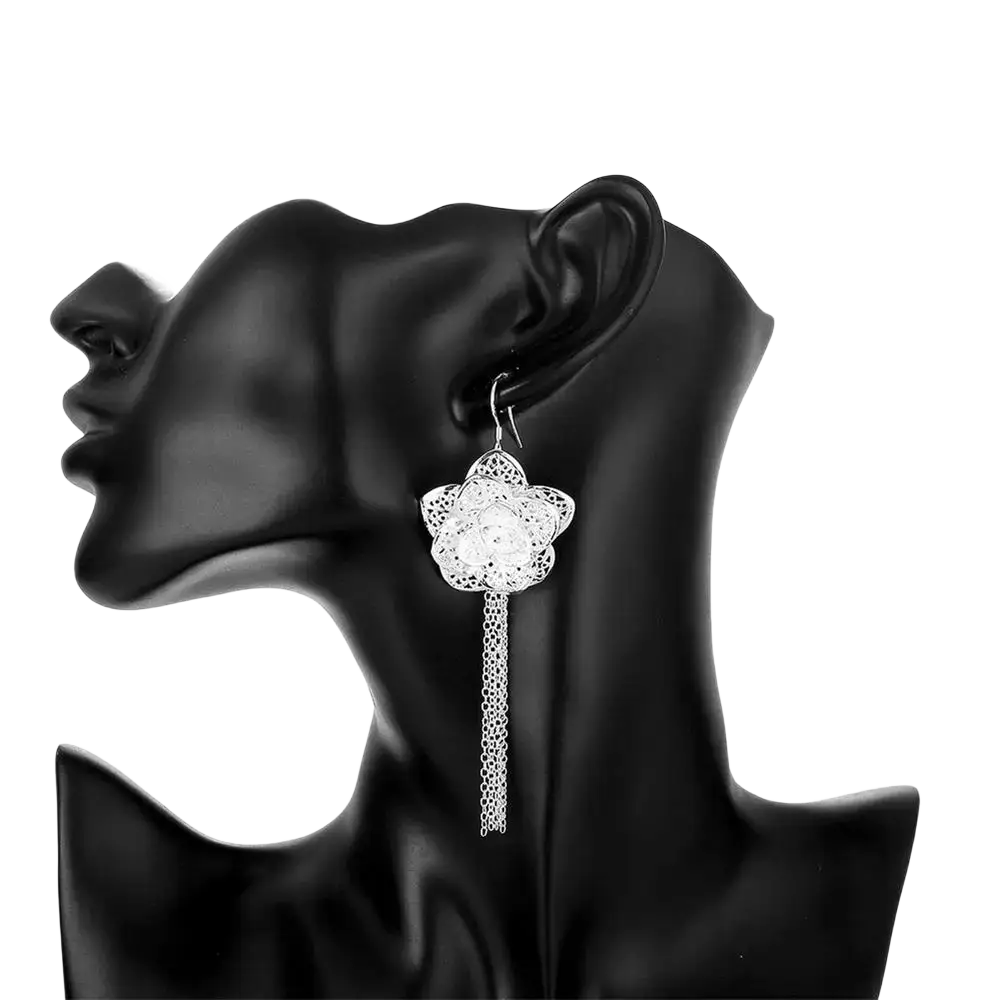 Sterling silver flower earring with intricate filigree design and dangling chain from a sterling silver jewelry set