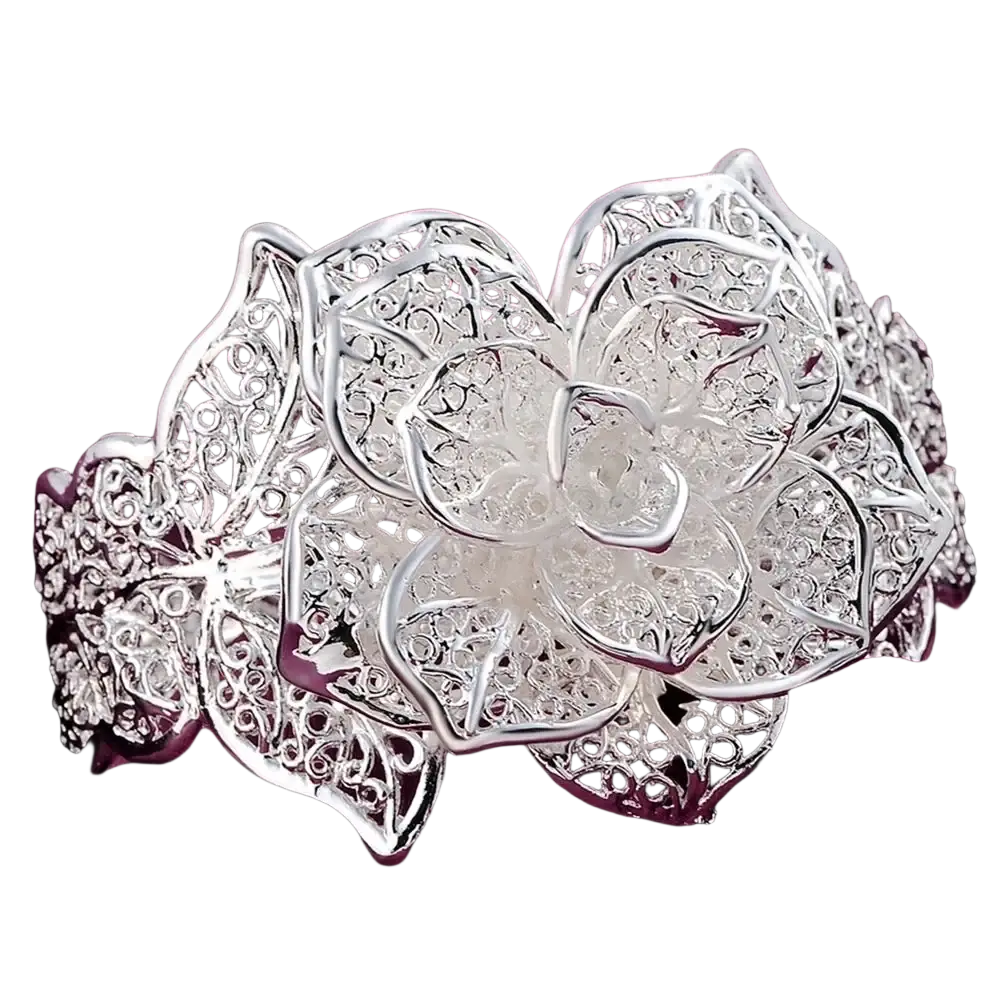 Sterling silver flower cuff bracelet with intricate lace-like filigree detailing and sparkling embedded stones