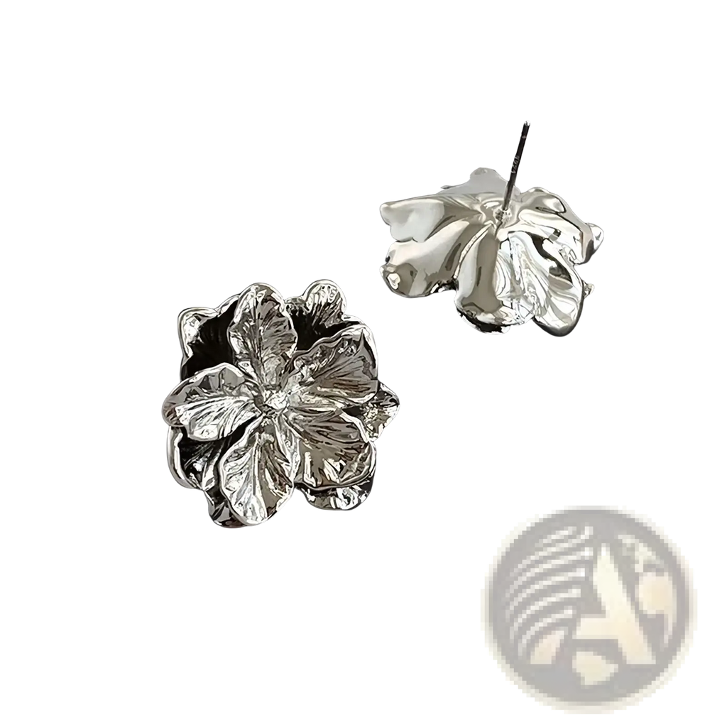 Sterling silver flower stud earrings in silver with an intricately designed metallic finish