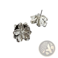Sterling silver flower stud earrings in silver with an intricately designed metallic finish
