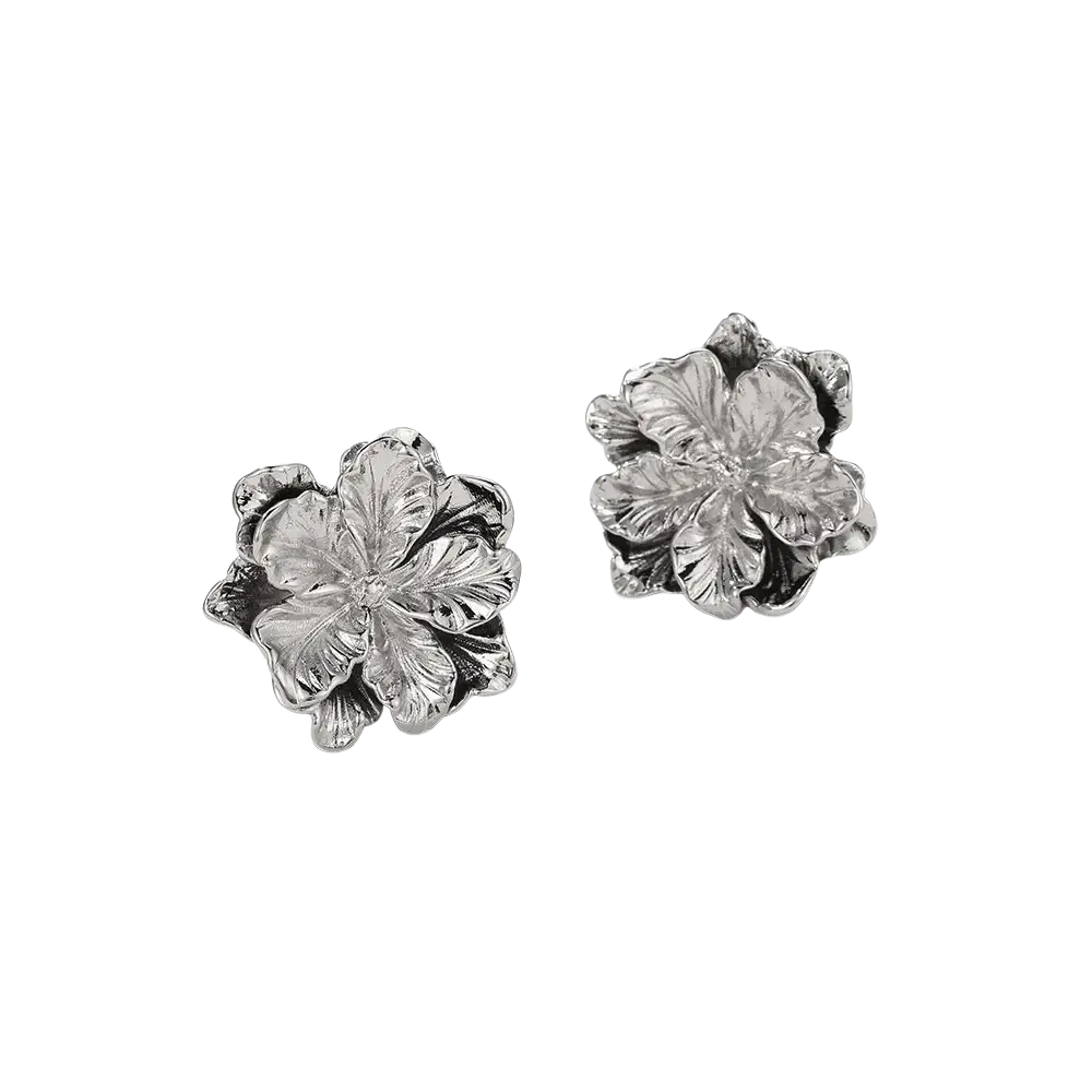Sterling silver flower stud earrings with detailed petal textures and a polished metallic finish