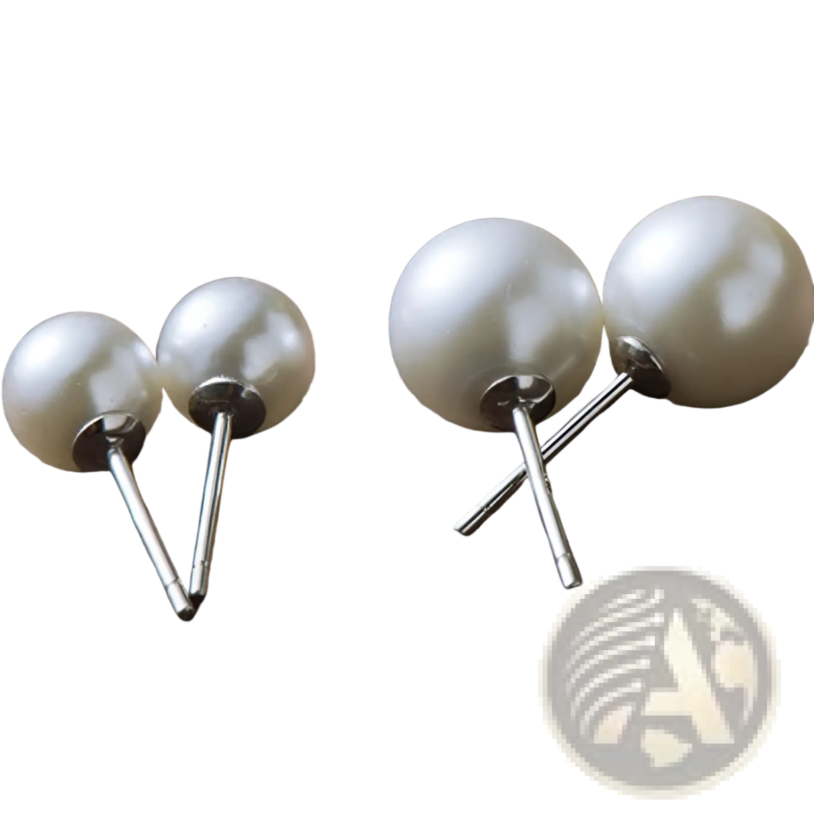 Sterling silver freshwater pearl stud earrings in 6mm and 8mm with lustrous white iridescent pearls on silver posts