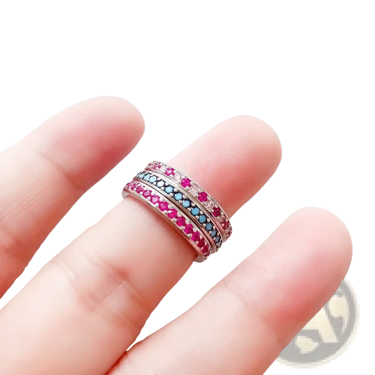 Sterling silver stacked ring featuring vibrant pink and blue gemstones set in a sleek silver band