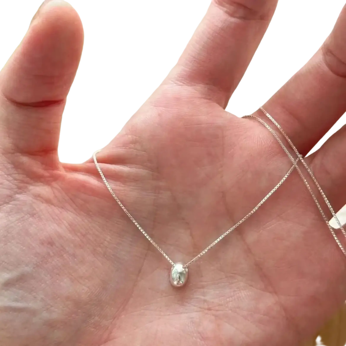 Sterling silver geometric pendant necklace with a delicate oval polished pendant and fine chain in silver color