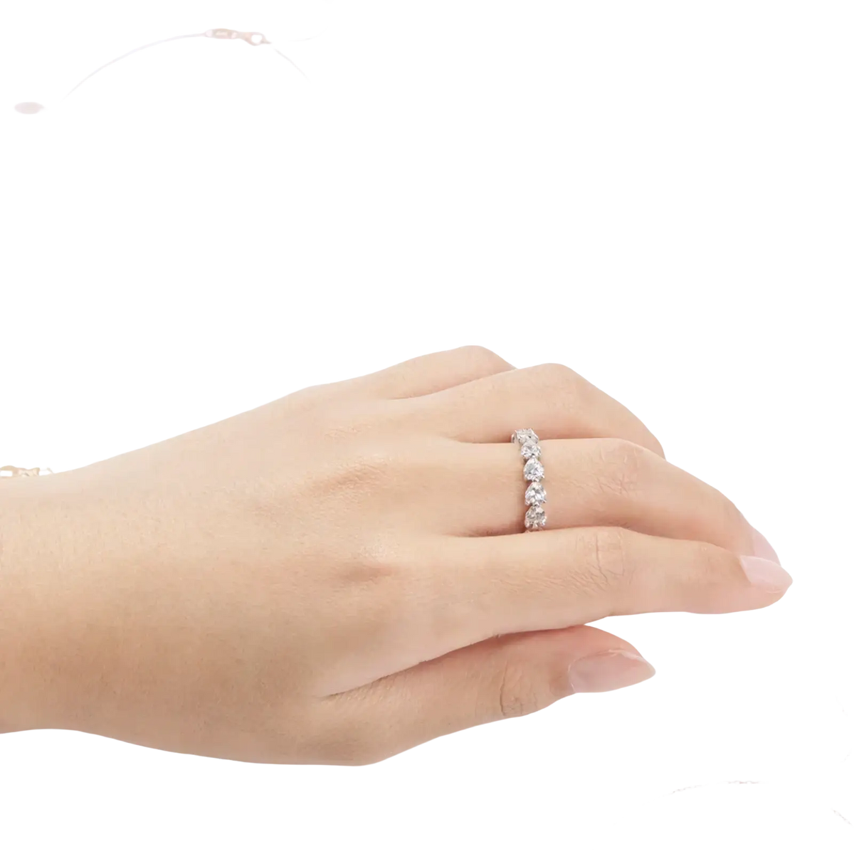 Sterling silver heart eternity ring with a delicate band featuring five round-cut sparkling diamonds in a line