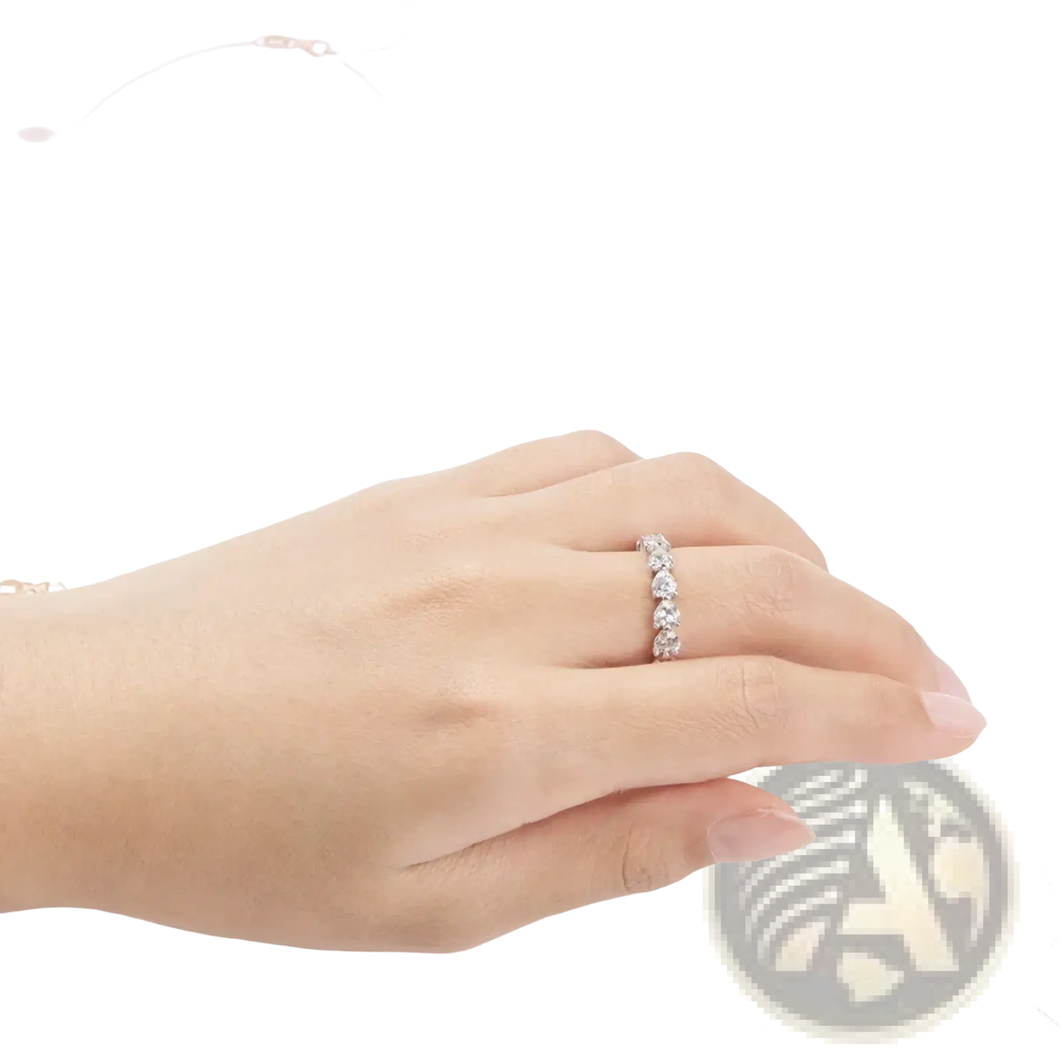 Sterling silver heart eternity ring with a delicate band featuring five round-cut sparkling diamonds in a line