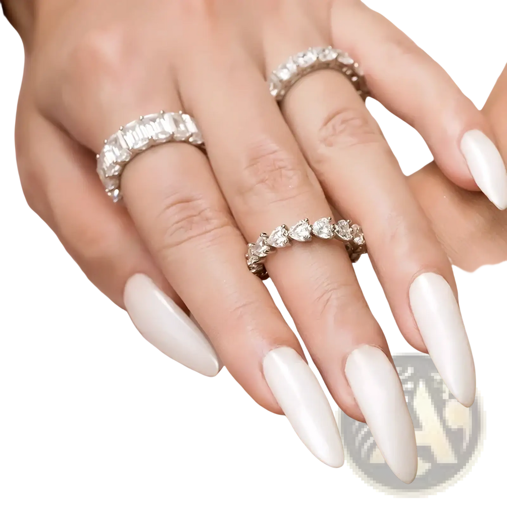 Elegant white acrylic nails with glossy finish featuring two sparkling sterling silver heart eternity rings on fingers