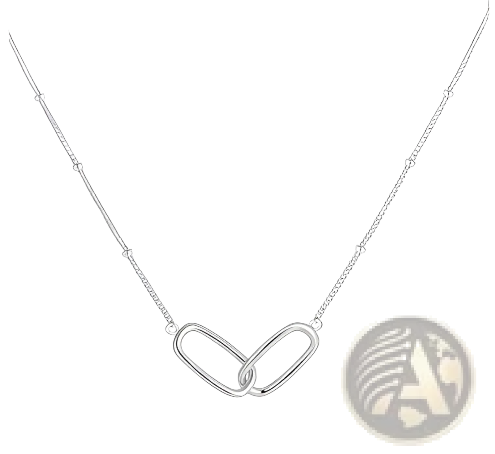 Sterling silver chain necklace with a minimalist interlocking oval pendant and green heart gemstone detail
