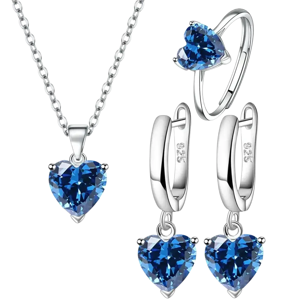 A sterling silver heart jewelry set with blue zircon gemstones featuring a necklace ring and dangling earrings