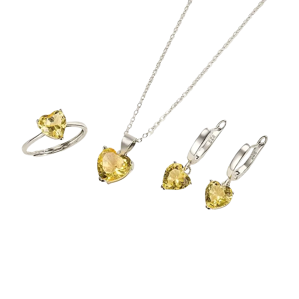 A sterling silver heart jewelry set with yellow zircon gemstones includes a ring pendant necklace and hoop earrings