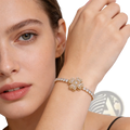 Sterling silver infinity heart adjustable bracelet with gold-toned floral cubic zirconia design and sparkling stones