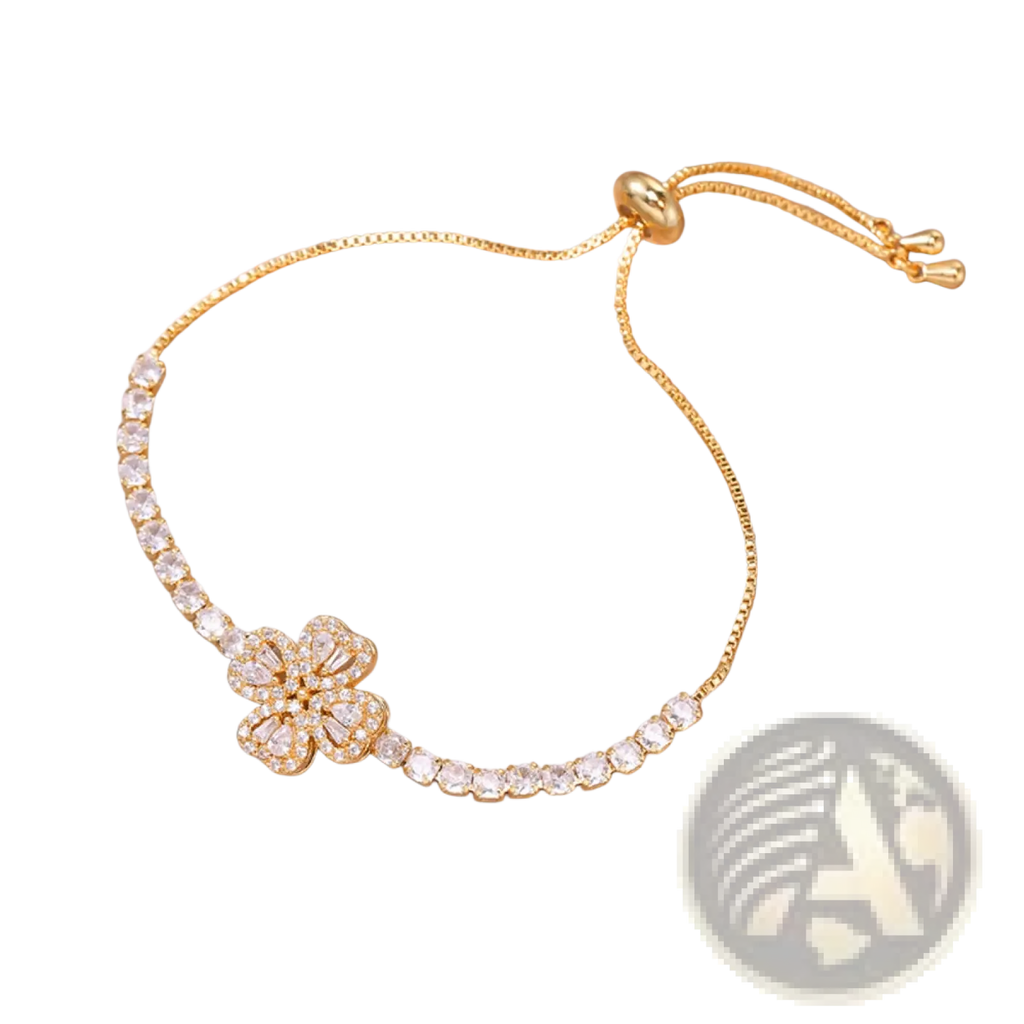 Gold-toned adjustable bracelet with a central four-petal flower design encrusted with clear crystals and sparkling stones