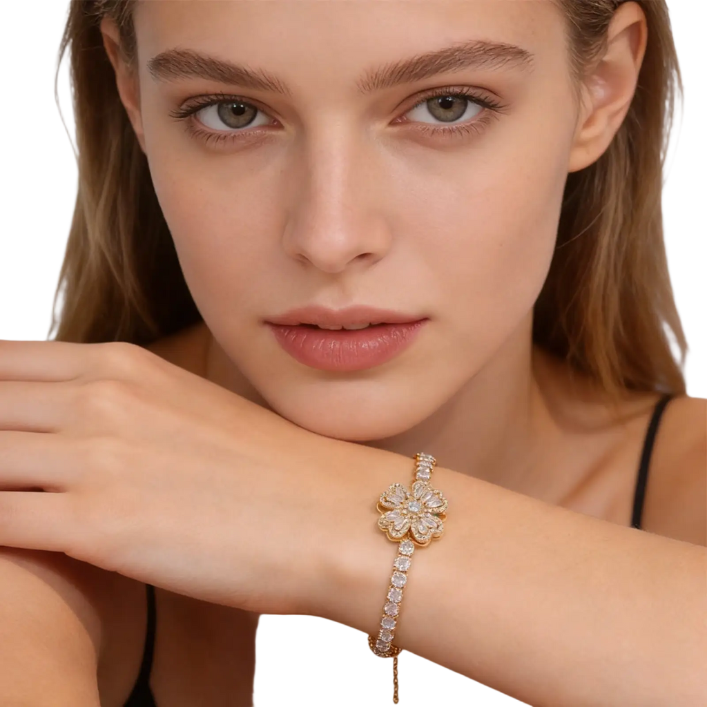 Gold-toned floral bracelet with sparkling diamonds and delicate chain complements sterling silver infinity heart adjustable cubic zirconia bracelet