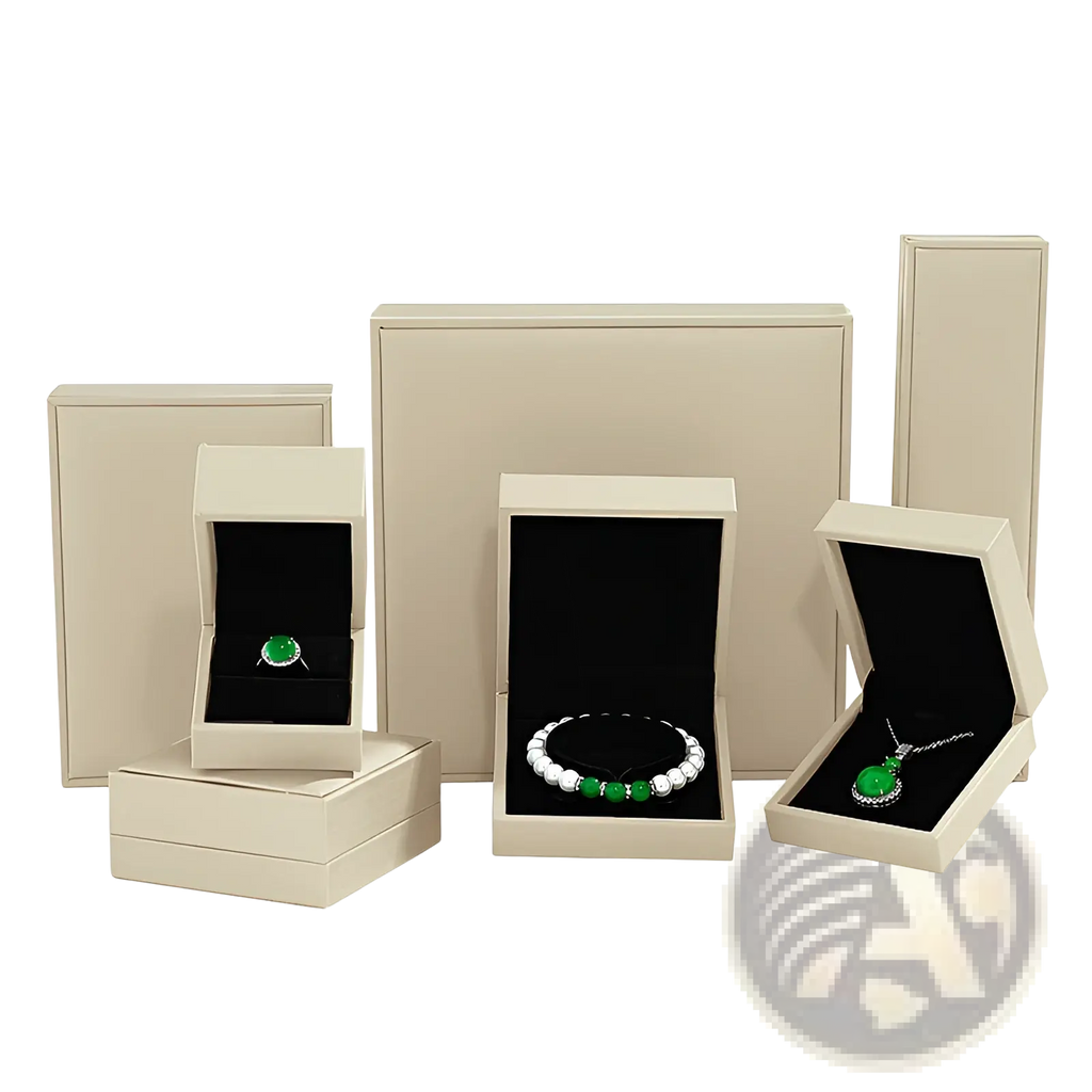 Beige luxury jewelry boxes with black velvet interiors displaying green gemstone sterling silver interlocking infinity heart pendant necklaces