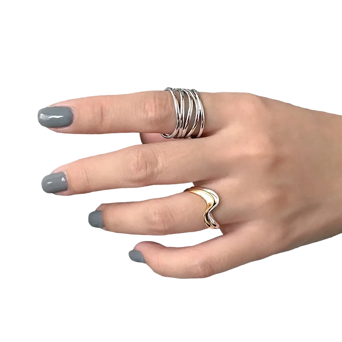A hand wearing a sterling silver interwoven adjustable ring and a sleek gold wavy ring on houndstooth fabric