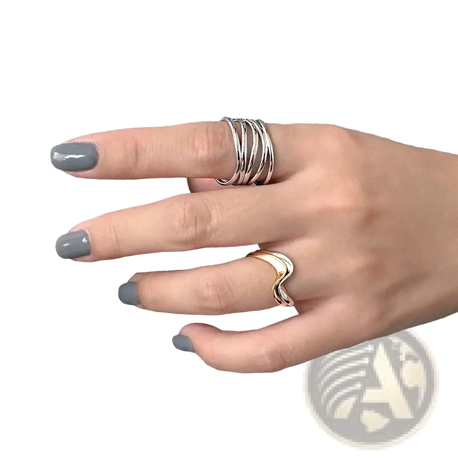 A hand wearing a sterling silver interwoven adjustable ring and a sleek gold wavy ring on houndstooth fabric
