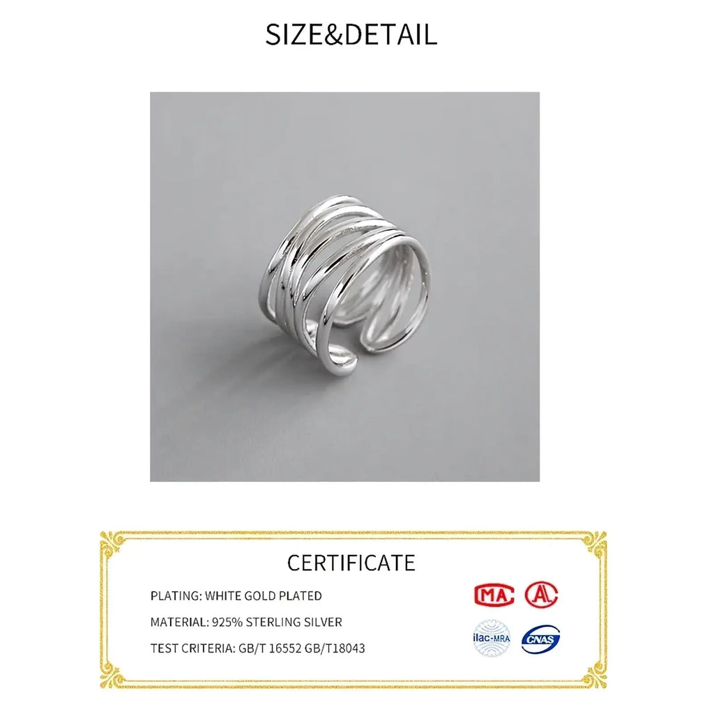 Sterling silver interwoven adjustable ring featuring a sleek multi-layered coiled design in silver tone