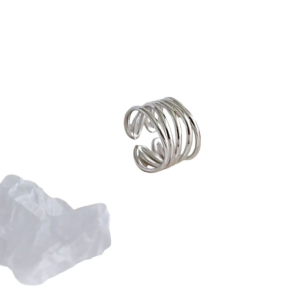 Sterling silver interwoven adjustable ring with a sleek coiled design in silver color