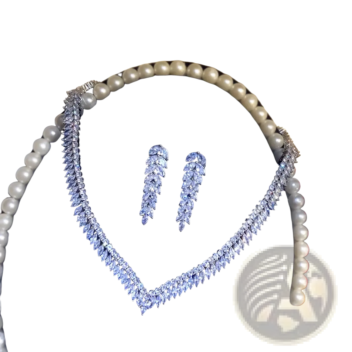 A sterling silver leaf bridal necklace with a v-shaped design featuring clear marquise-cut stones in intricate metalwork