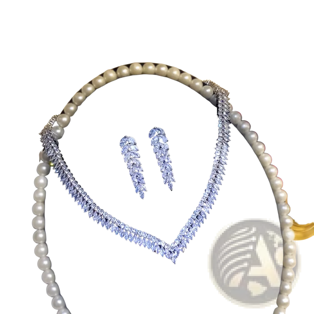 Sterling silver leaf bridal jewelry set featuring an elegant silver-toned diamond-studded v-shaped necklace with matching drop earrings