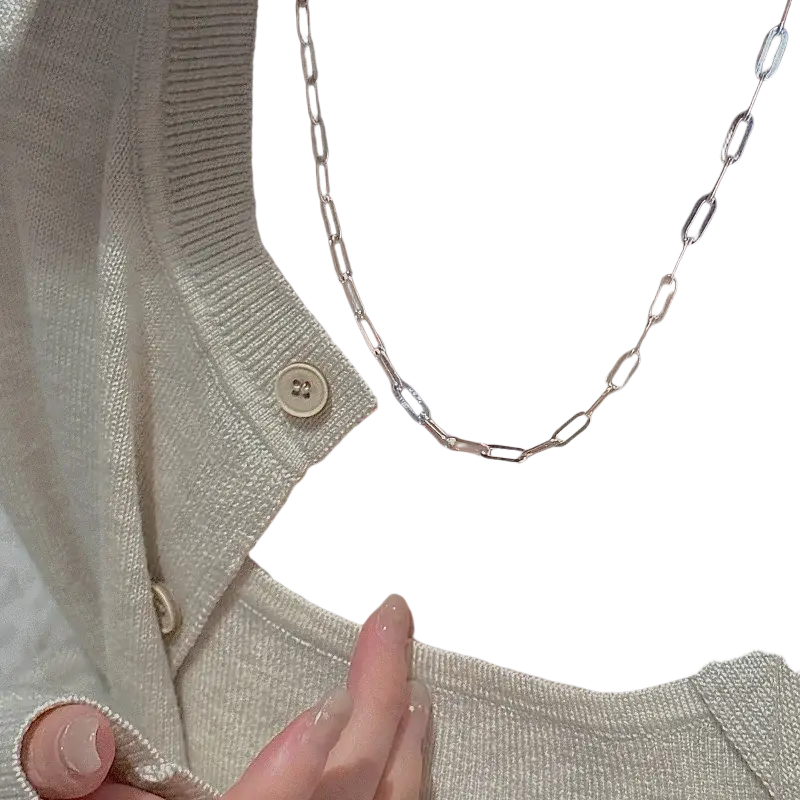 Sterling silver minimalist paperclip chain necklace with delicate elongated links and subtle blue accents