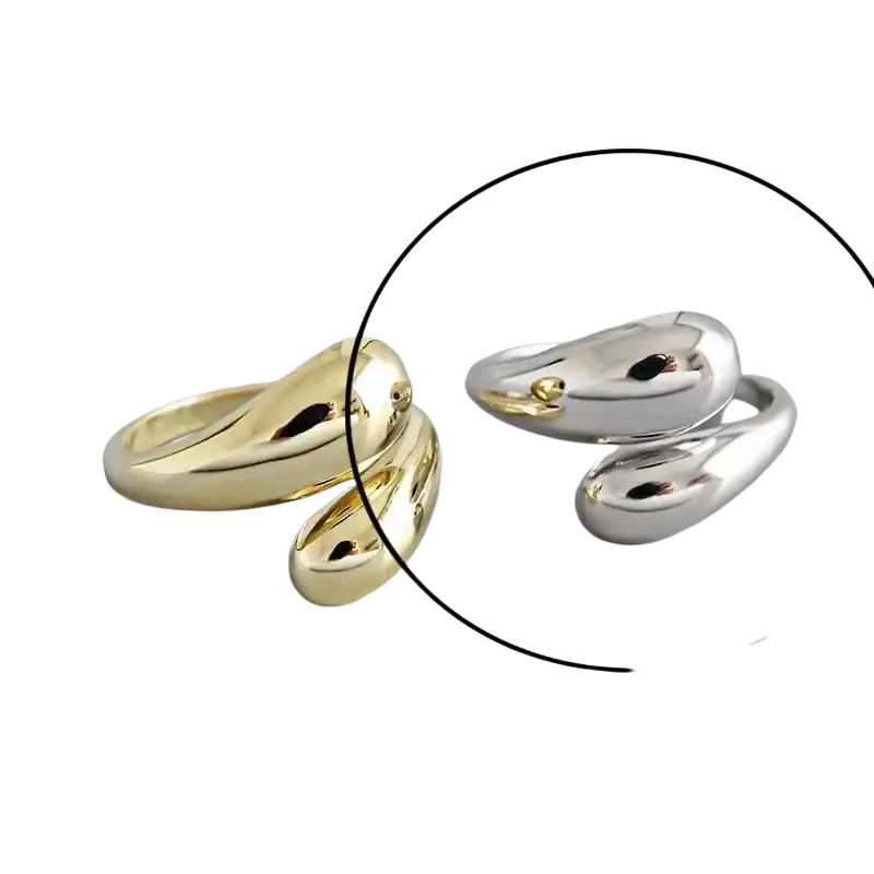 Sterling silver open ring for women shaped like a sleek minimalist snake with a polished silver finish and gold accent eye