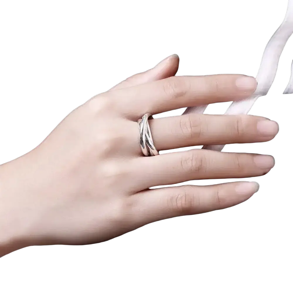 A sleek silver-toned sterling silver ring for women featuring a modern twisted design and simple three circles