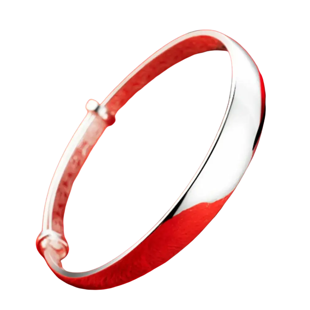 Sterling silver round bangle bracelet for women with a sleek silver tone, smooth polished exterior, and engraved inner band