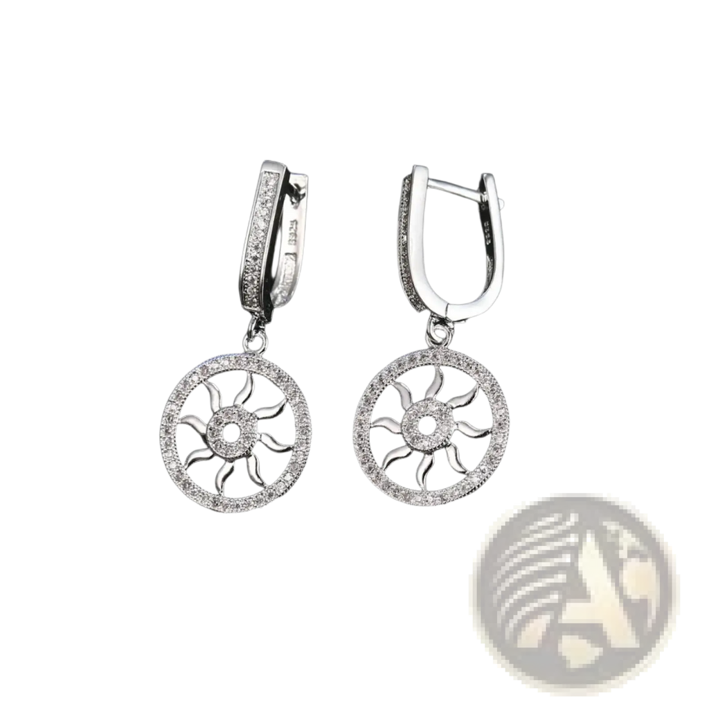 Sterling silver sunburst hoop earrings with pave diamond border and central crystal accent in hinged design