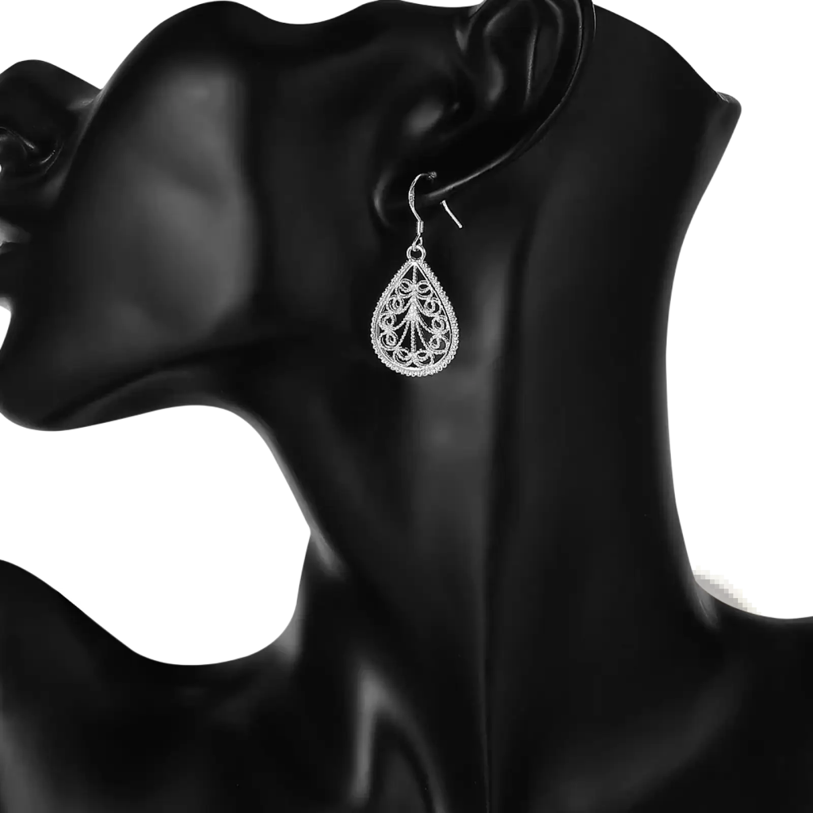 Sterling silver teardrop filigree earring with intricate lace-like detailing in a teardrop jewelry set