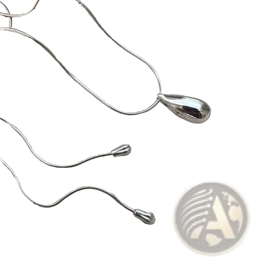 Sterling silver teardrop necklace with smooth polished finish and delicate snake chain fine jewelry accessory