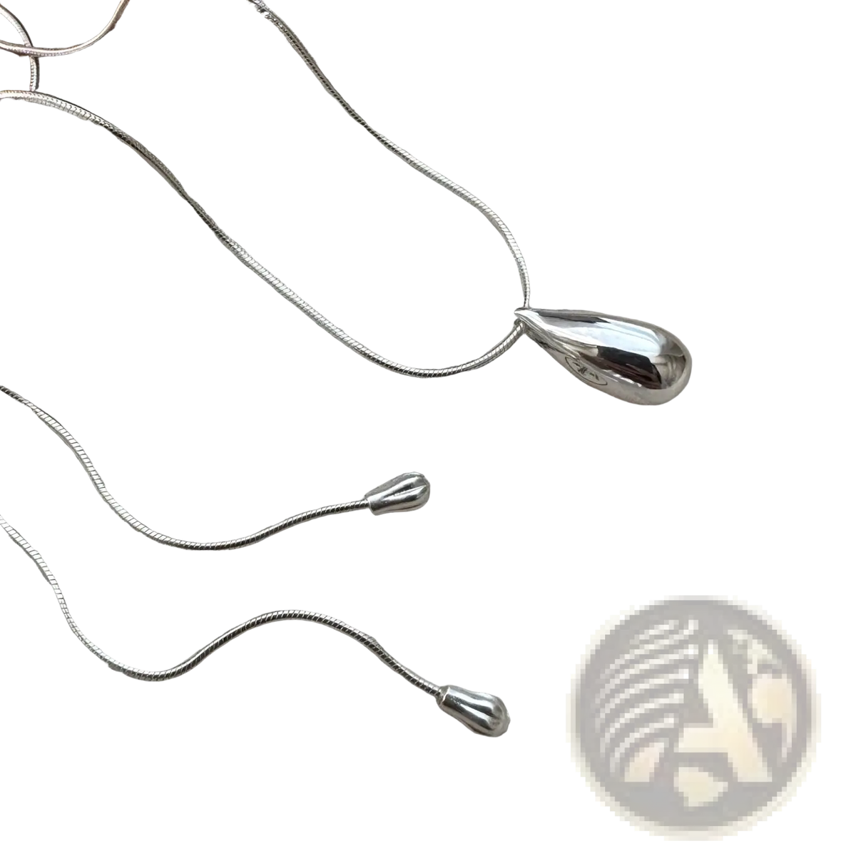Sterling silver teardrop necklace with smooth polished finish and delicate snake chain fine jewelry accessory