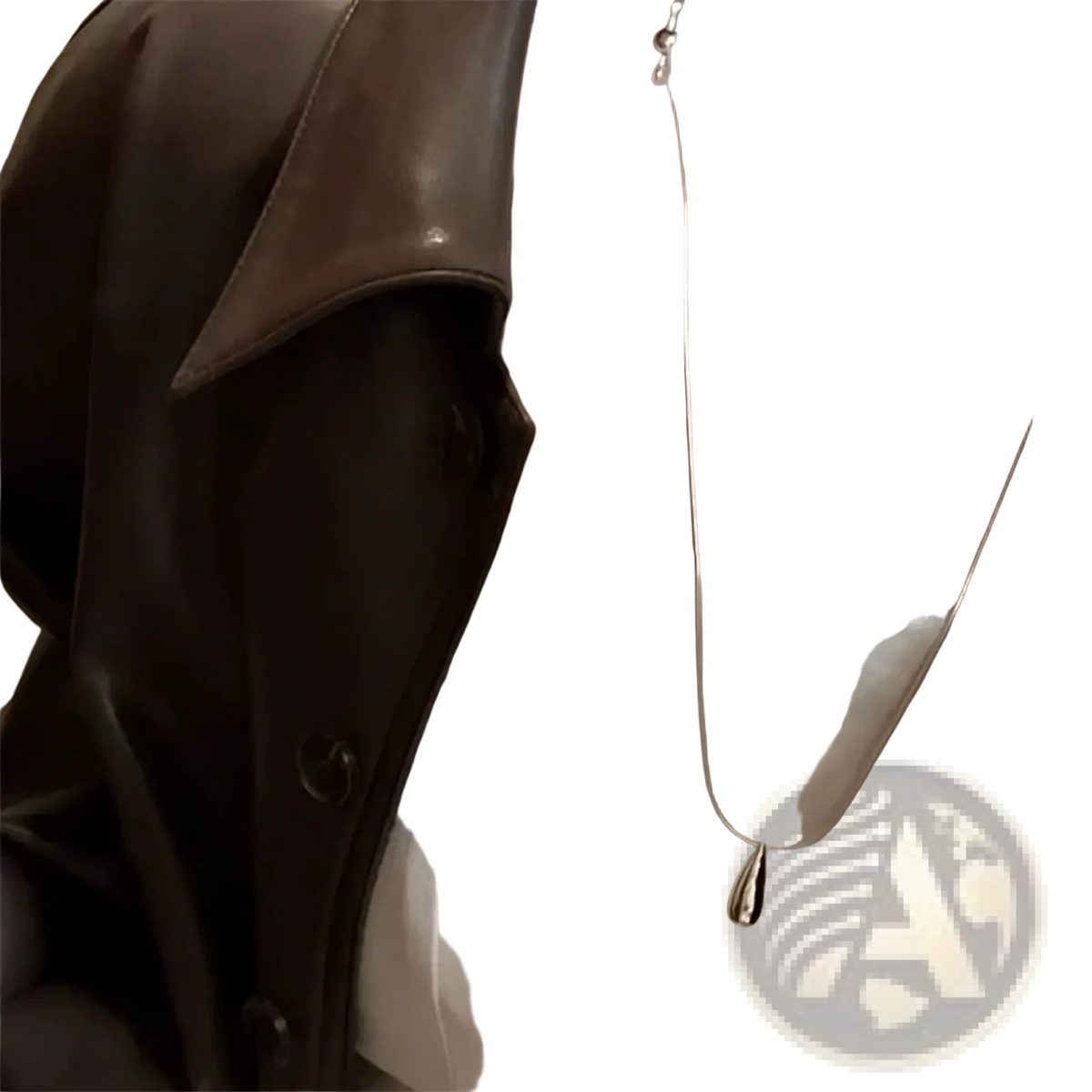 A sleek silver teardrop pendant necklace with a smooth minimalist design made of sterling silver fine jewelry