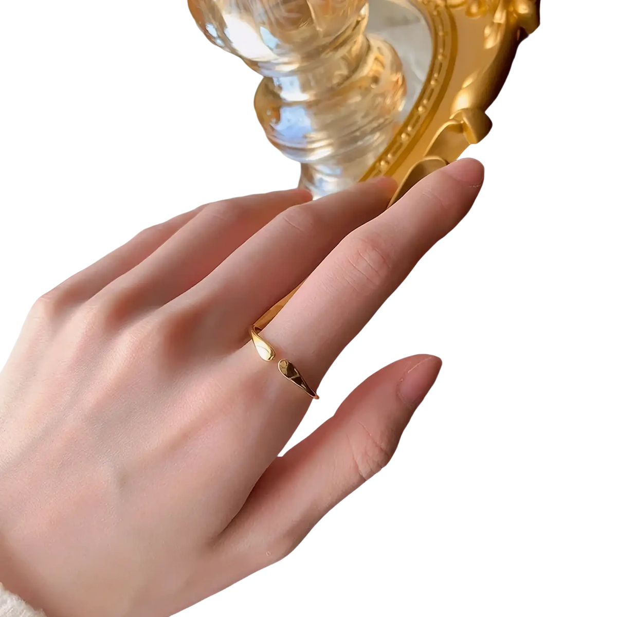 Sterling silver teardrop stackable ring with a delicate gold band featuring two small contrasting stones white and dark