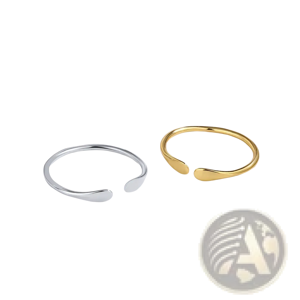 Two minimalist open-ended sterling silver and gold teardrop rings designed for stackable wear