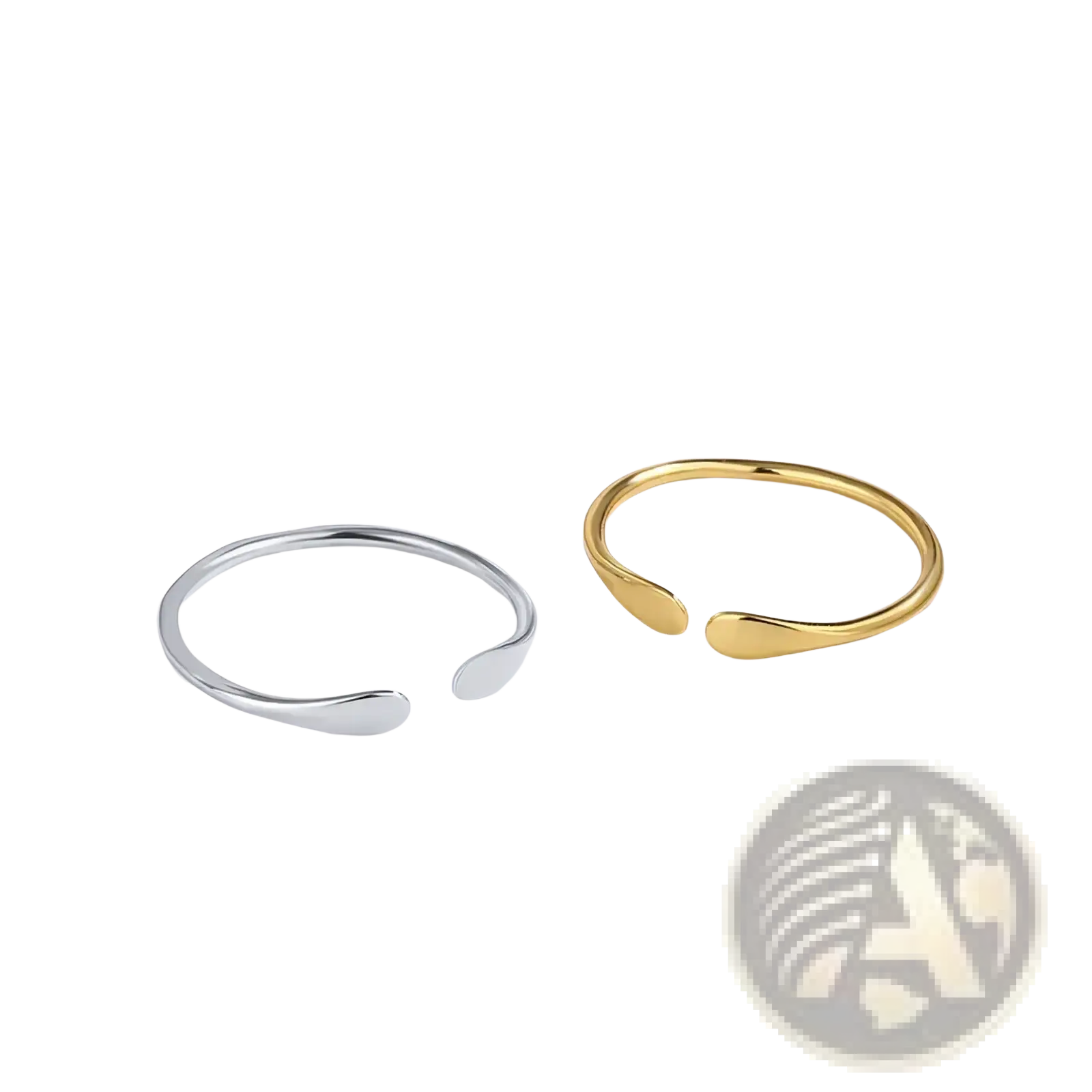 Two minimalist open-ended sterling silver and gold teardrop rings designed for stackable wear