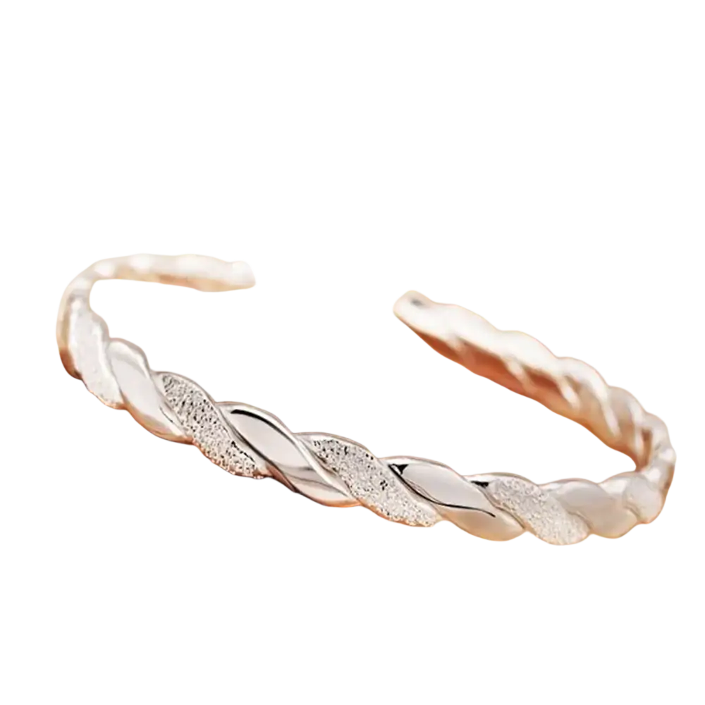 Sterling silver twisted bangle bracelet with a textured sparkling finish in silver color