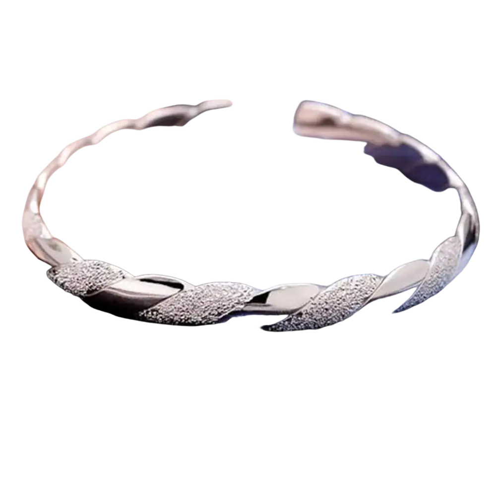 Sterling silver twisted bangle bracelet with textured leaf-like segments and polished reflective finish