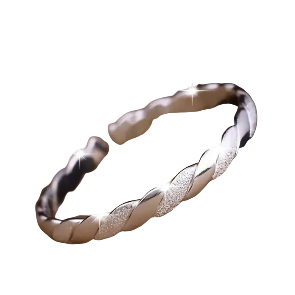 Sterling silver twisted bangle bracelet with a sleek textured glittering surface and polished metallic finish