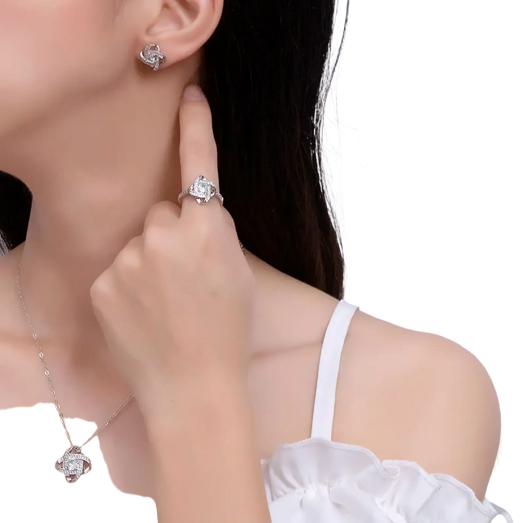 Silver-toned sterling silver zircon knot four-petal flower earrings with diamond-studded detailing for elegant wear