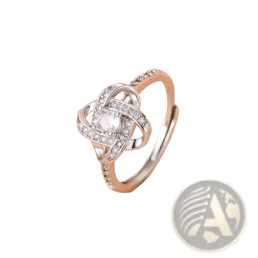 Sterling silver zircon knot ring featuring a central clear gemstone and smaller diamonds in an intricate design