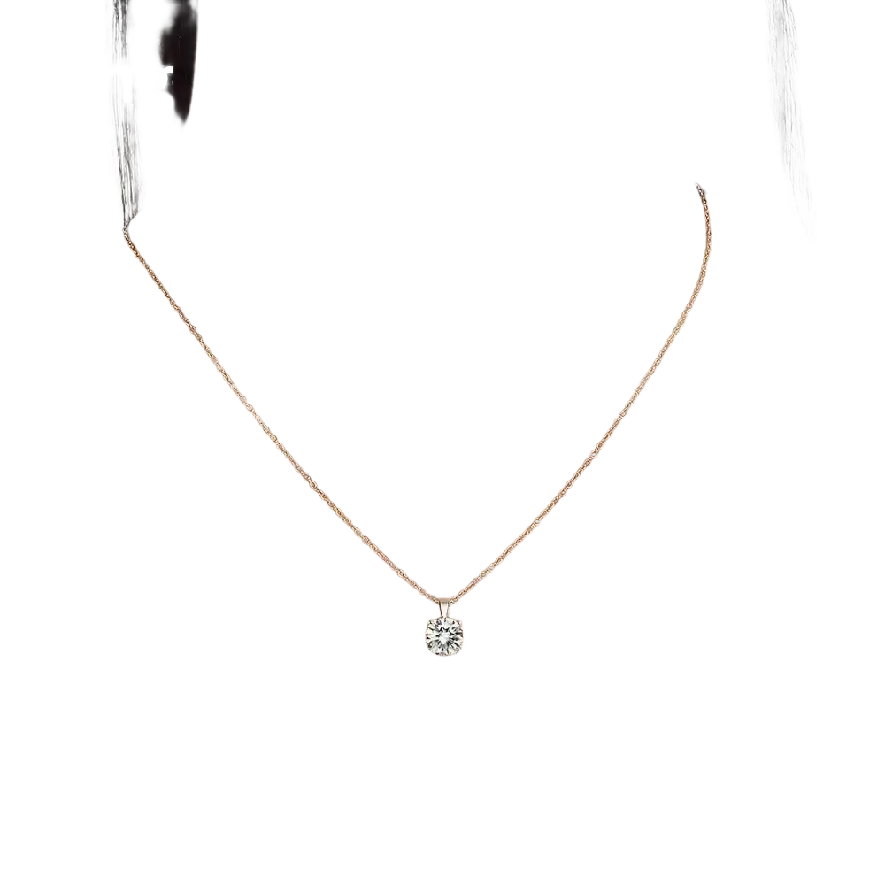 A delicate sterling silver zircon pendant necklace with a gold chain and a single sparkling round-cut diamond pendant