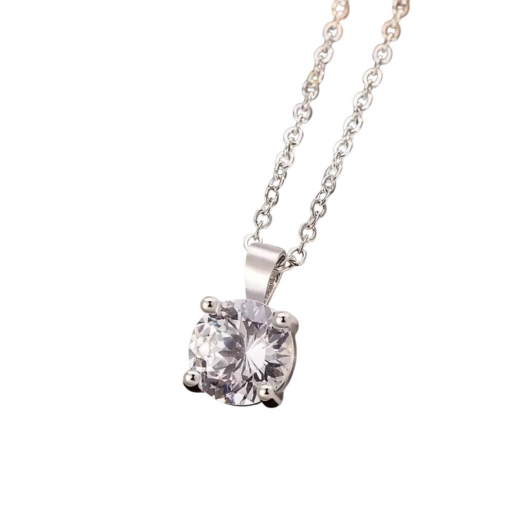 Sterling silver zircon pendant necklace with a round clear crystal set in four prongs on an elegant silver chain