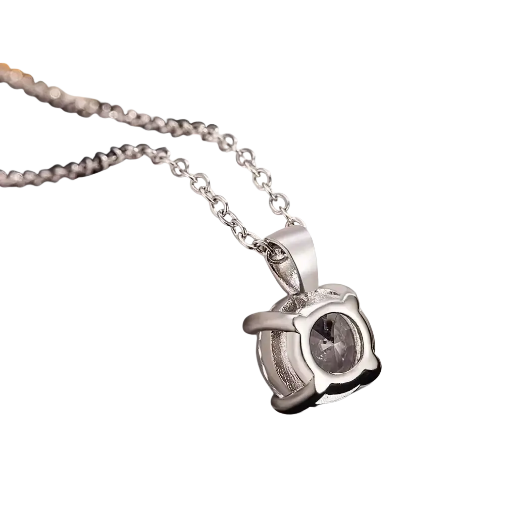 Sterling silver zircon pendant necklace with a silver-toned wing-shaped frame and central faceted gray gemstone