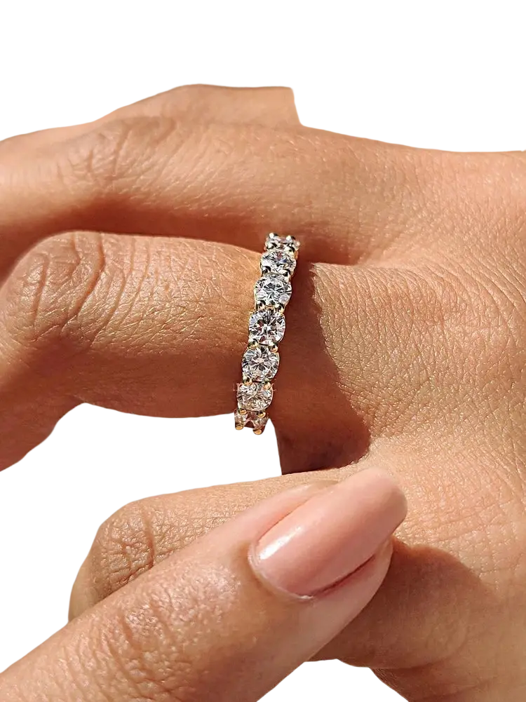 Sterling silver zircon wedding band for women with a continuous line of round-cut stones in white gold
