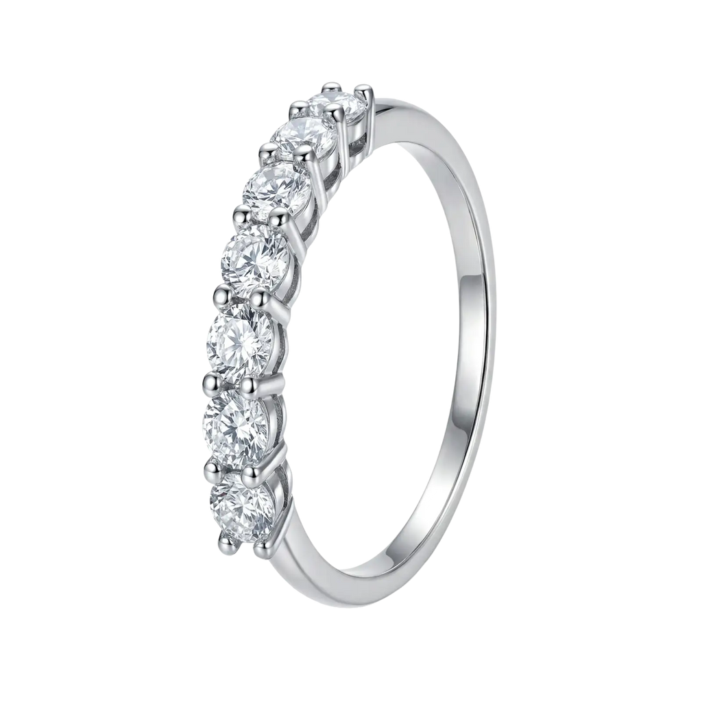 A sterling silver zircon wedding band for women with a sleek silver band and seven round-cut diamonds in prongs