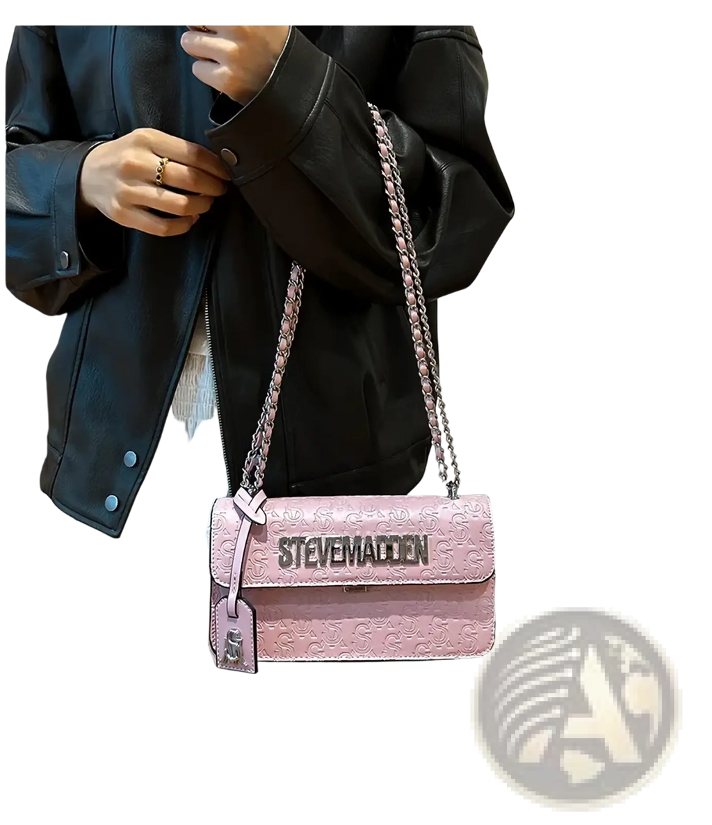 Pink textured leather steve madden quilted crossbody bag with silver chain strap and embossed logo